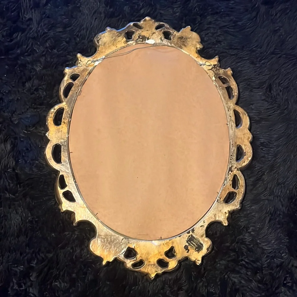This a painted gold mirror I got at a market to match my dark academia aesthetic